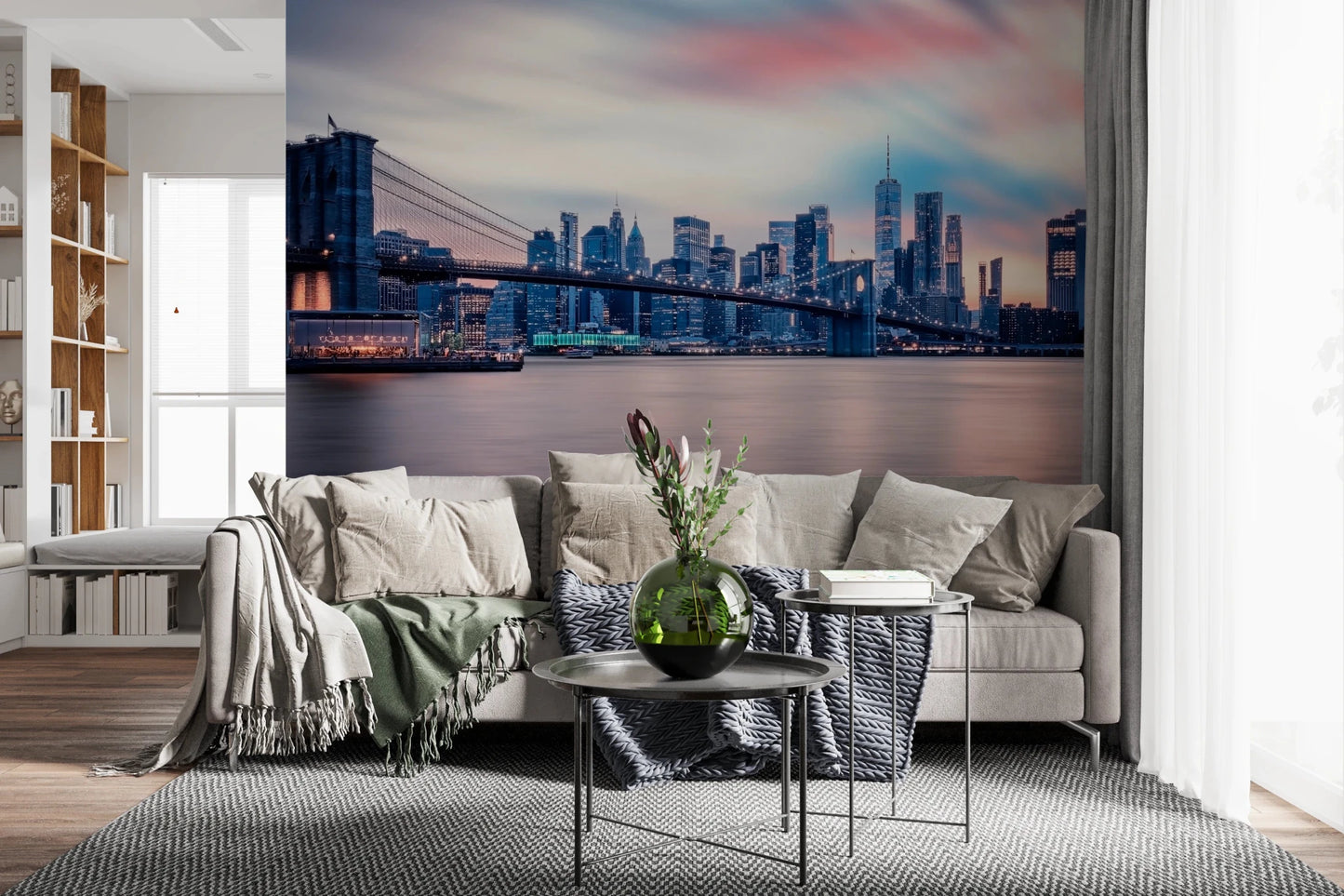 NYC Twilight Dreams wallpaper mural of Manhattan at twilight behind a beige sofa and round metal tables