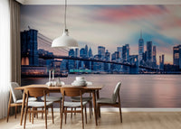 NYC Twilight Dreams wallpaper mural of the Brooklyn Bridge at dusk above a wood dining table and chairs