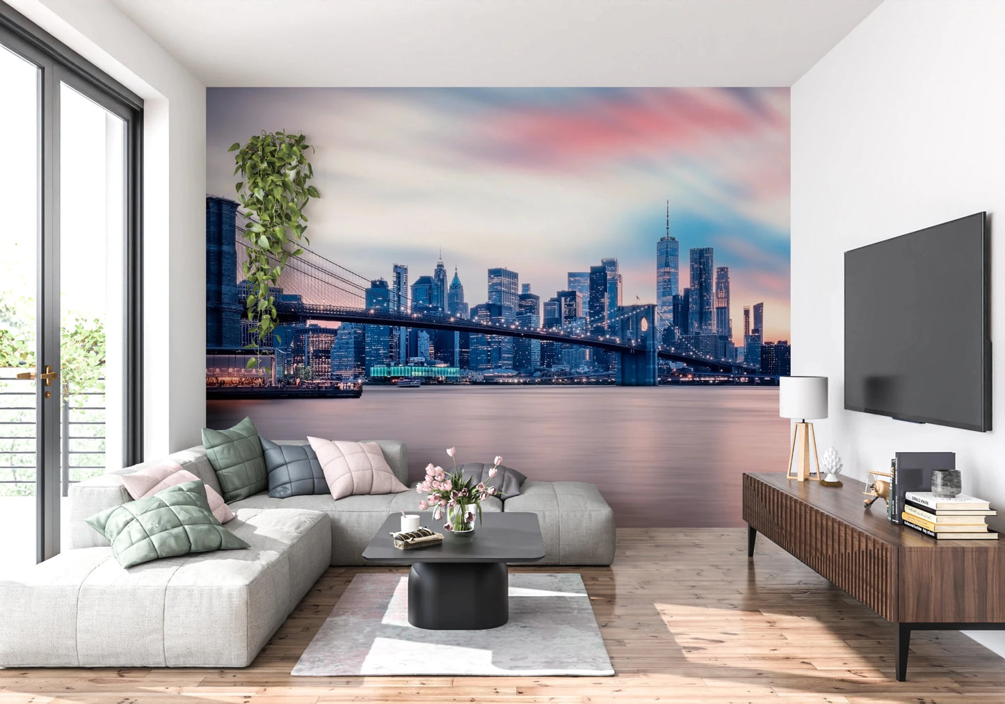 NYC Twilight Dreams wallpaper mural of Brooklyn Bridge at dusk above a grey sectional sofa near a TV unit
