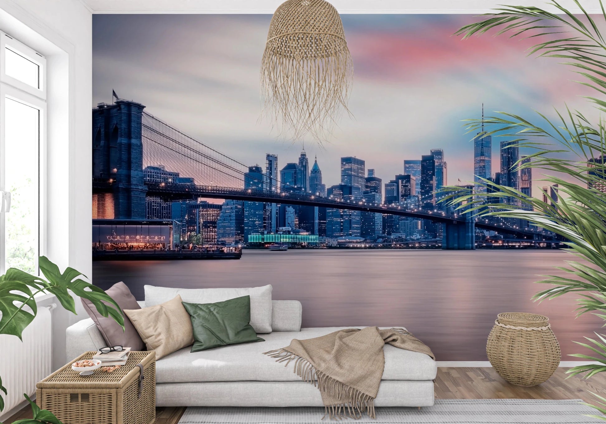 NYC Twilight Dreams wallpaper mural of the bridge and skyline beside a white chaise sofa and leafy plants