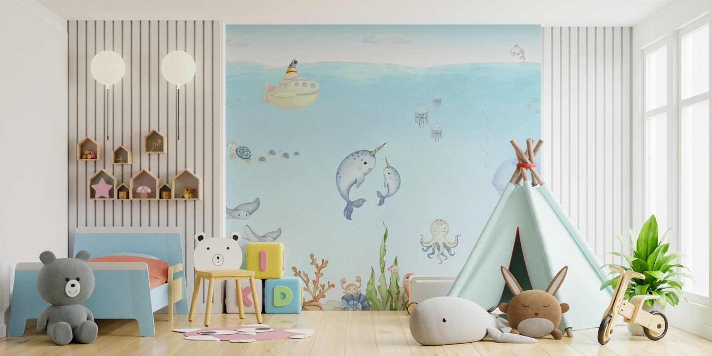 Ocean Explorer Watercolor wallpaper of submarine and narwhals behind a blue toddler bed and mint teepee tent