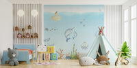 Ocean Explorer Watercolor wallpaper of submarine and narwhals behind a blue toddler bed and mint teepee tent