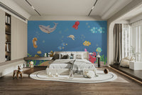 The design features a group of friendly cartoon sea animals and coral.

