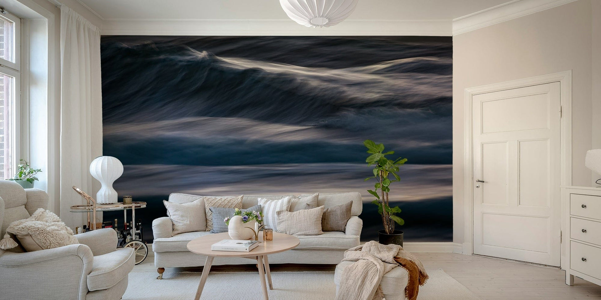 A bedroom with the wall mural behind the headboard.

