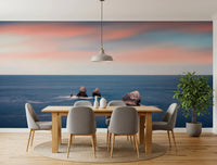 Blush horizon wall mural brightens coastal room