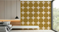 Simple geometric motif featuring woven-texture ochre circles on a soft beige background