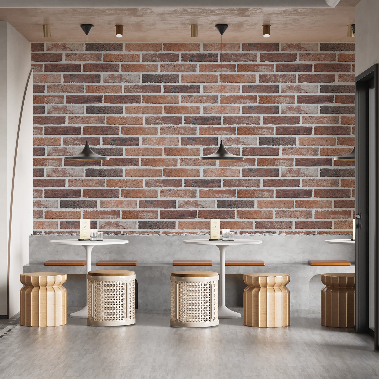 Old Dirty Red Brick wallpaper mural in a cafe with white round tables, rattan stools and black pendant lamps