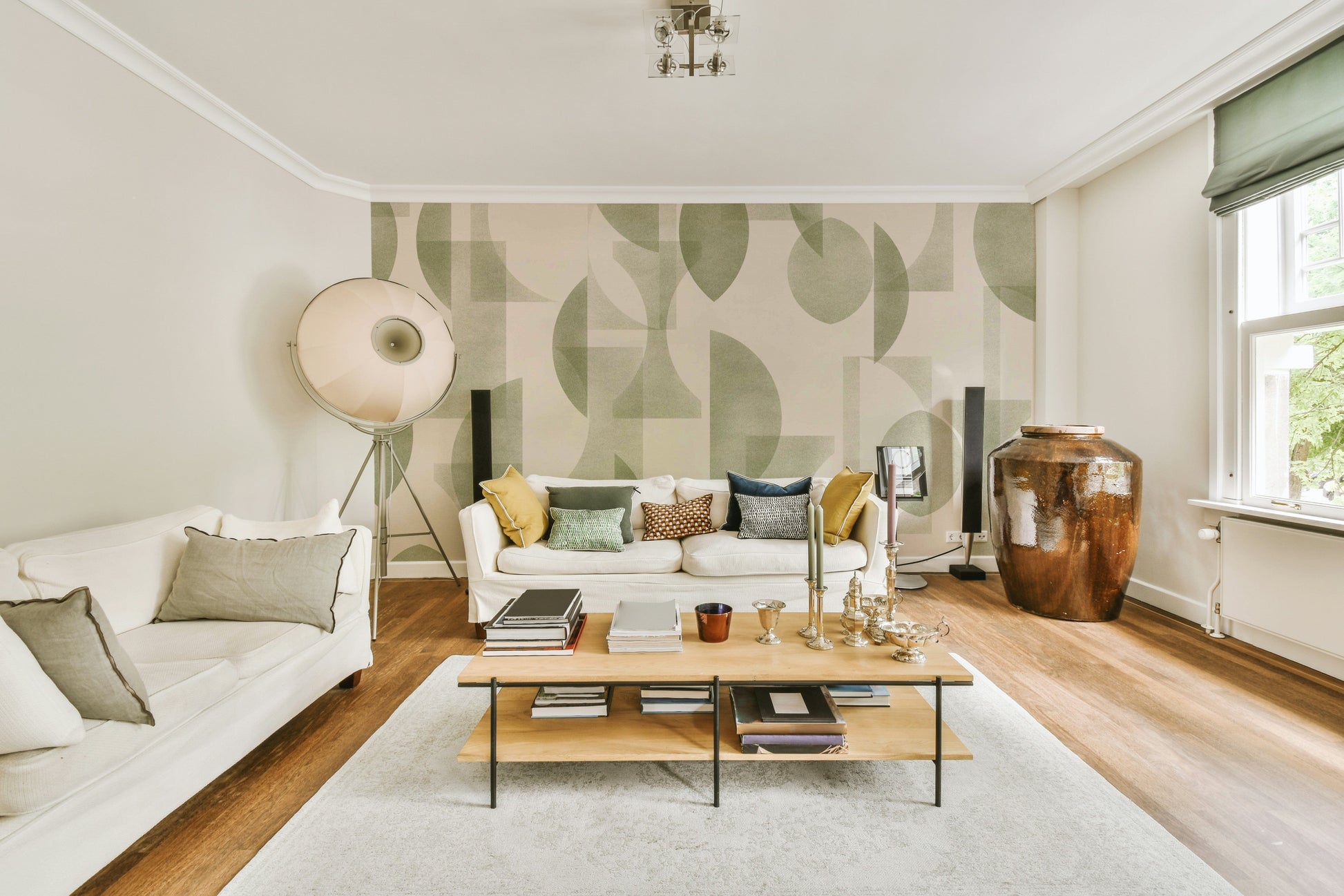 A dining area decorated with a geometric mural

