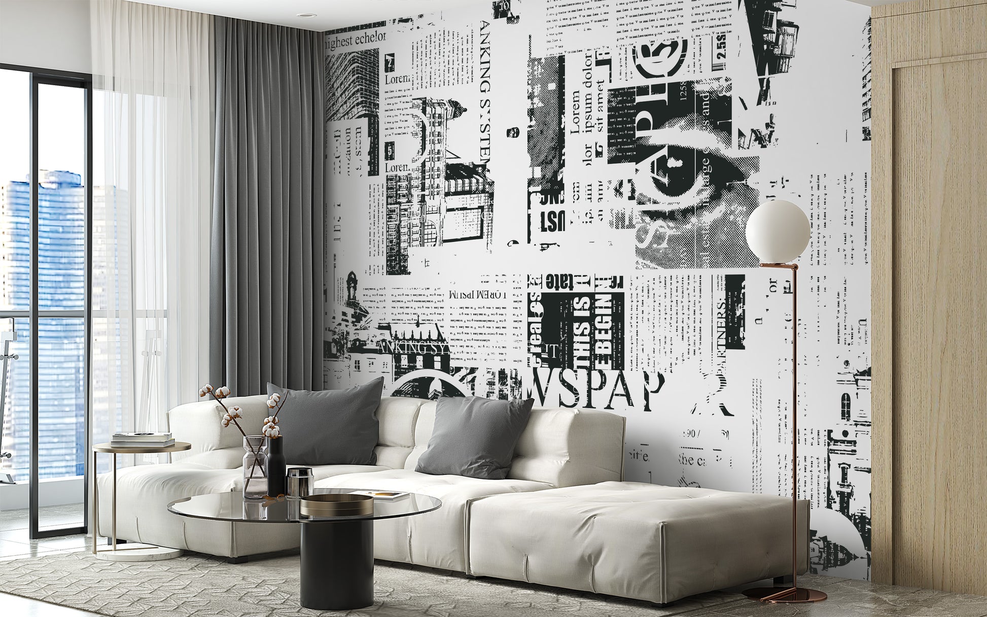 Urban Newsprint wallpaper mural in newspaper collage behind a cream sectional sofa with a city view in a living room