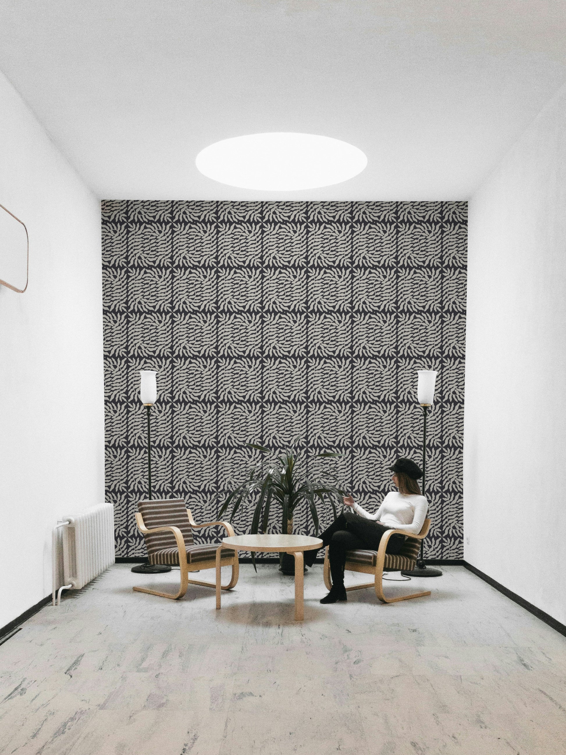 Minimalist taupe wallpaper with botanical ferns

