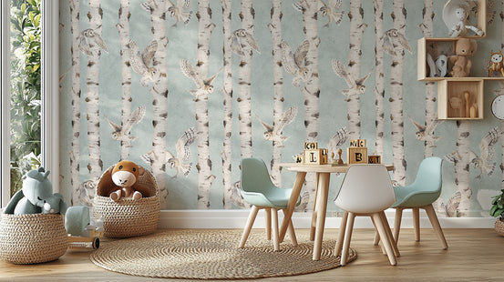 Owl Birch Forest - Blue wallpaper mural behind a kids play table with mint chairs and a teddy basket