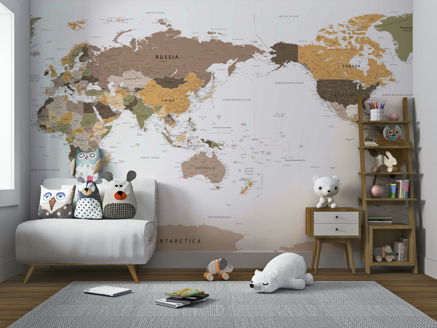 Pacific Centered Travel Map wallpaper mural over a white loveseat with owl pillows and a polar bear toy