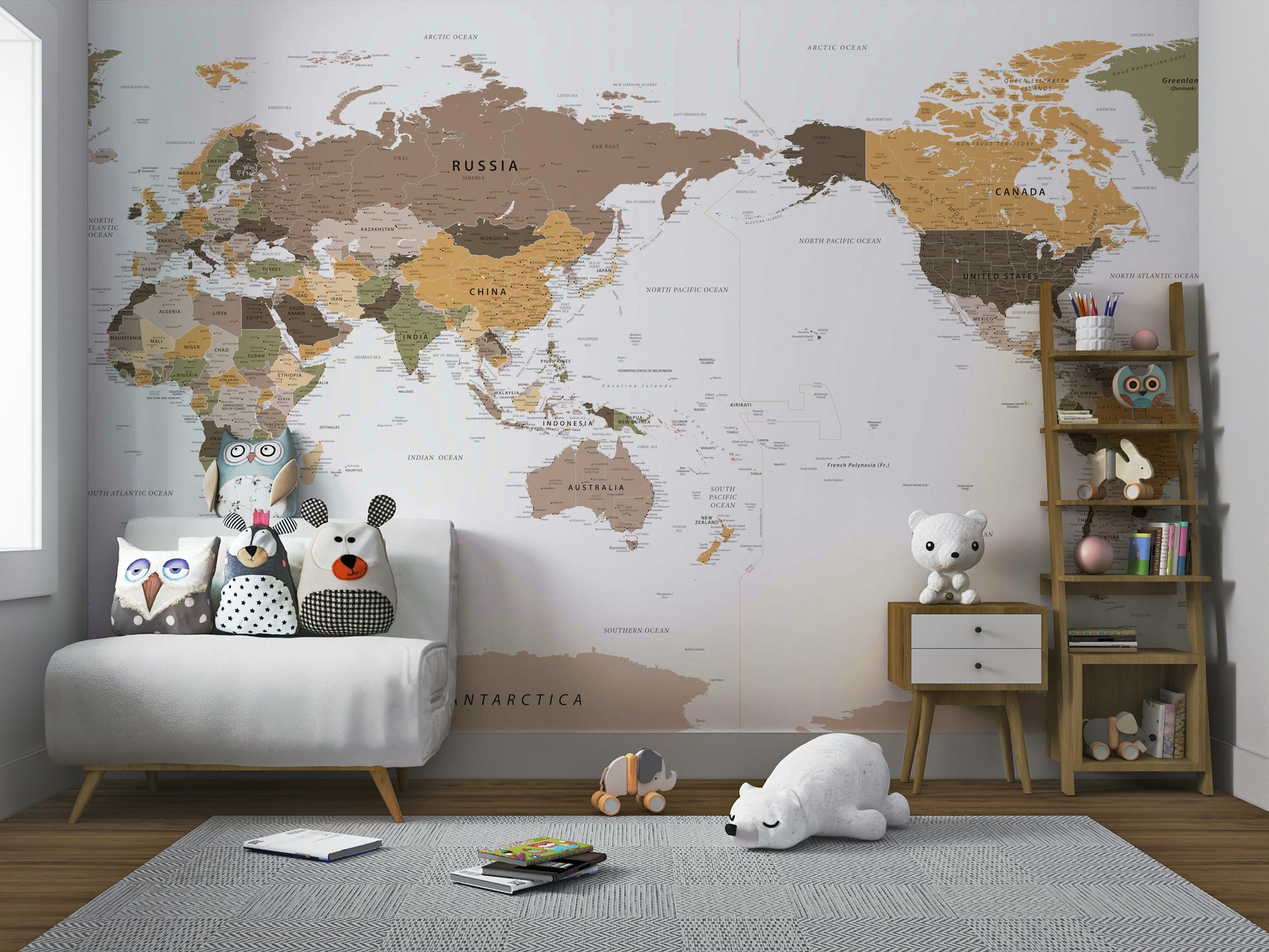 Pacific Centered Travel Map wallpaper mural over a white loveseat with owl pillows and a polar bear toy