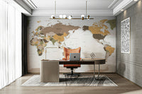 Pacific Centered Travel Map wallpaper mural in earthy tones behind a wood desk and orange office chair