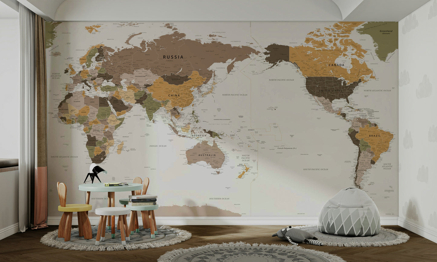 Pacific Centered Travel Map wallpaper mural in a kids room with a mint toddler table and gray bean bag