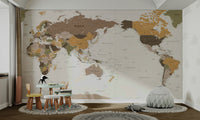 Pacific Centered Travel Map wallpaper mural in a kids room with a mint toddler table and gray bean bag