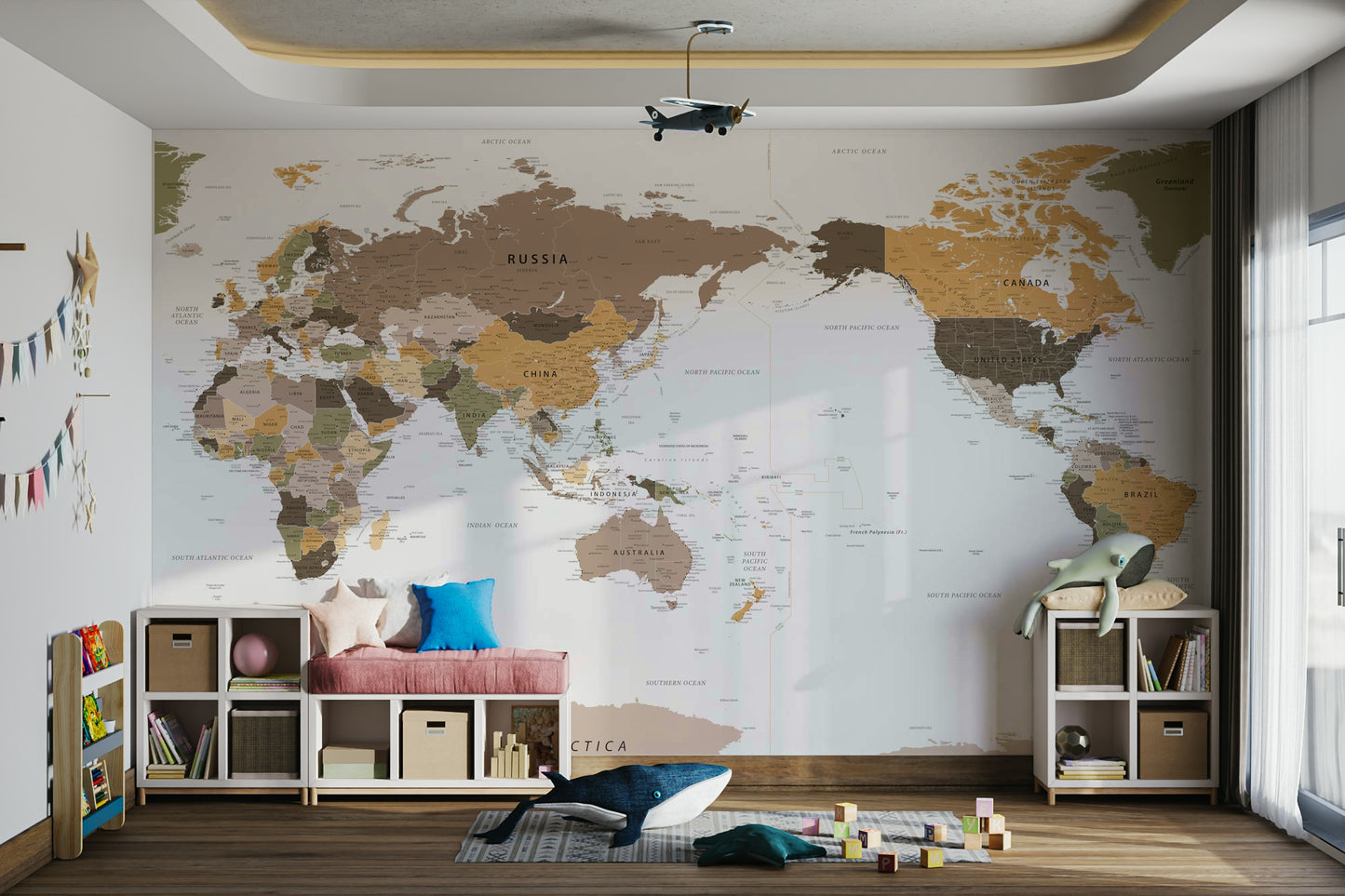 Pacific Centered Travel Map wallpaper mural in a kids room with white cube benches and a whale plush