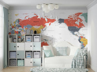 Pacific Centered World Map in Happy Colors wallpaper mural in a kids room with cube storage bins and a white daybed