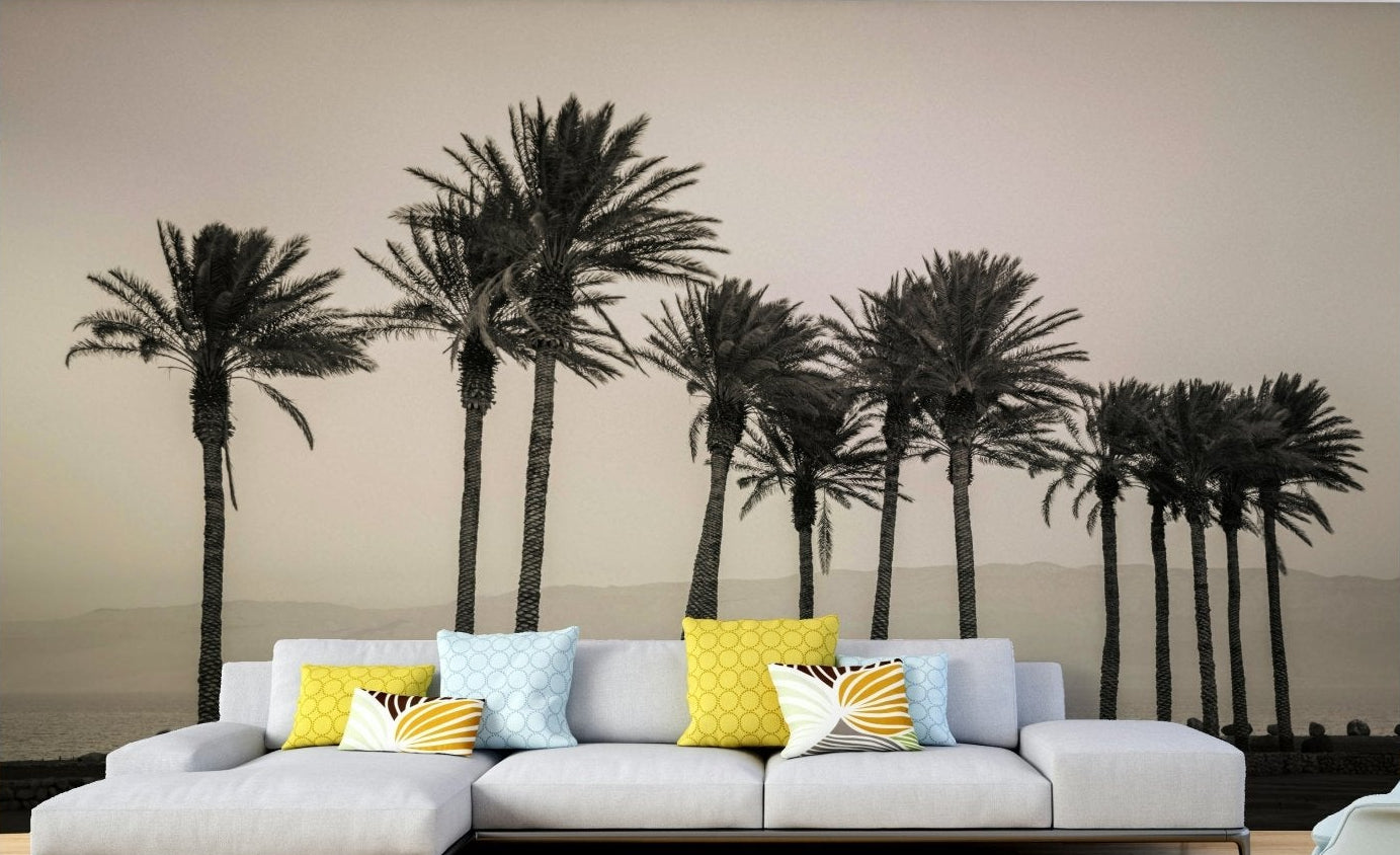 Tall palm trees along the serene beach in a wall mural

