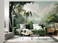 Palm Vista wallpaper mural of a tropical forest behind a green velvet sofa and wood sideboard in a living room