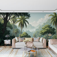Palm Vista wallpaper mural of a jungle valley behind a blush cream sofa on a gold-striped rug in a living room
