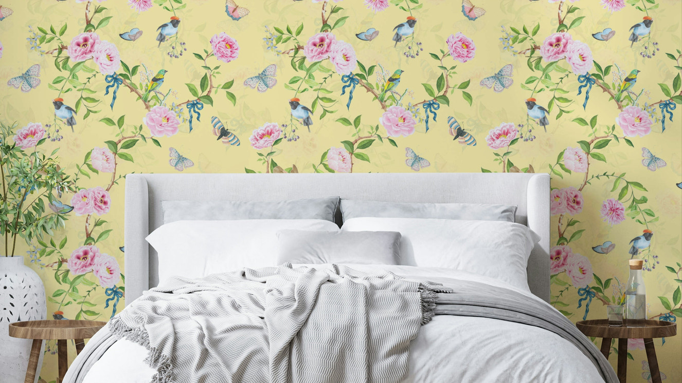 Pastel Paradise Chinoiserie Wallpaper with soft yellow background and birds.

