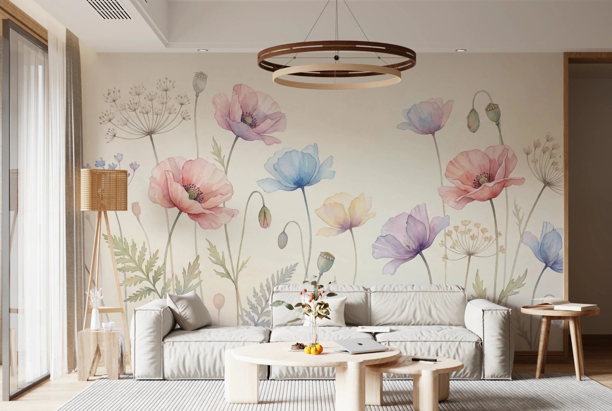 Pastel Poppy Field wallpaper mural with watercolor poppies behind a gray sofa and round wood table in a living room