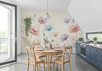 Pastel Poppy Field wallpaper mural of soft poppies above a round wood dining table with blue kitchen cabinets nearby