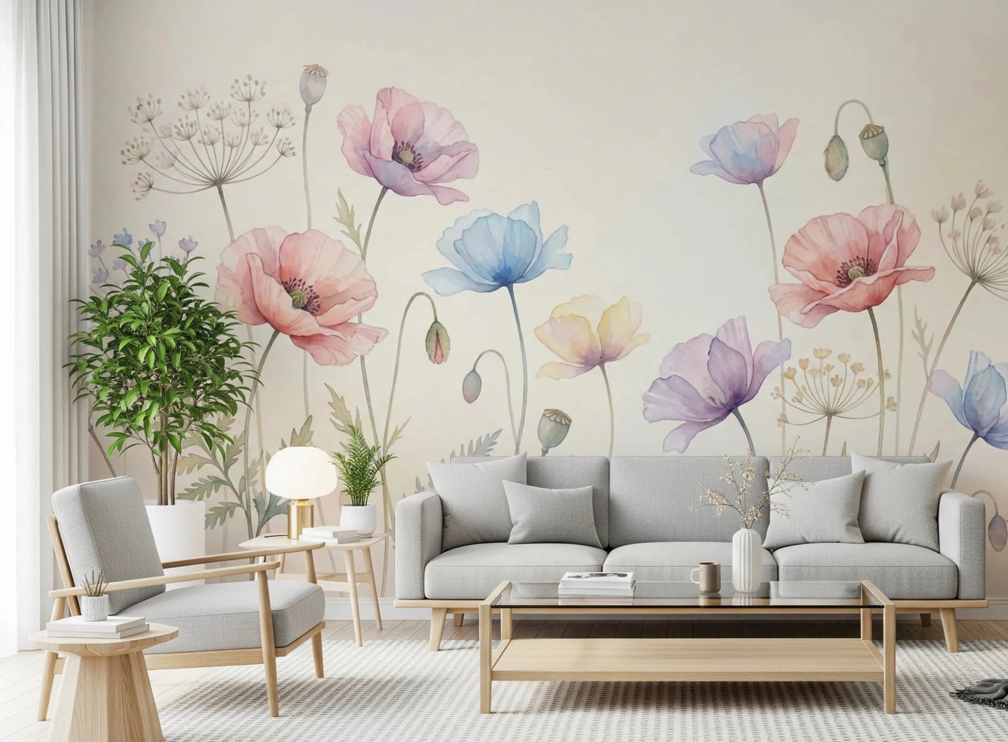 Pastel Poppy Field wallpaper mural of soft poppies behind a gray sofa and armchair with a tall green plant