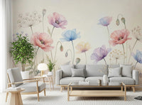 Pastel Poppy Field wallpaper mural of soft poppies behind a gray sofa and armchair with a tall green plant