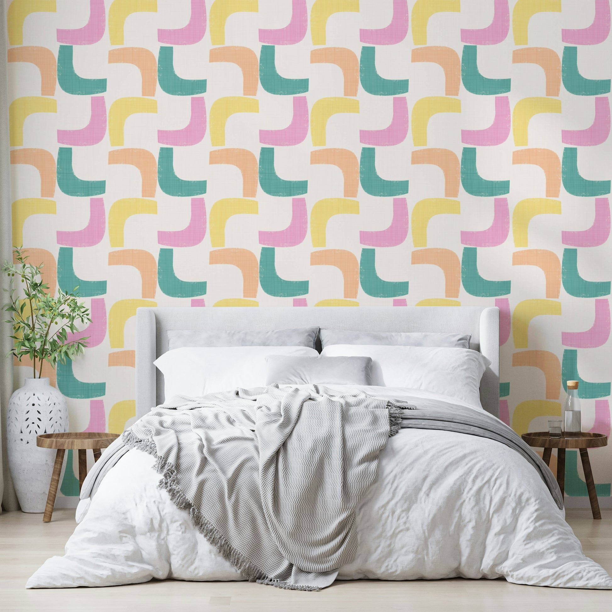 Mid-century modern boomerang design wallpaper in turquoise, pink, and mint.

