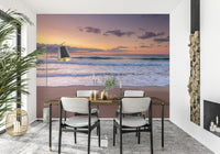 Peace at the Beach wallpaper mural of a sunset shoreline in a dining room with a wood table and black chairs