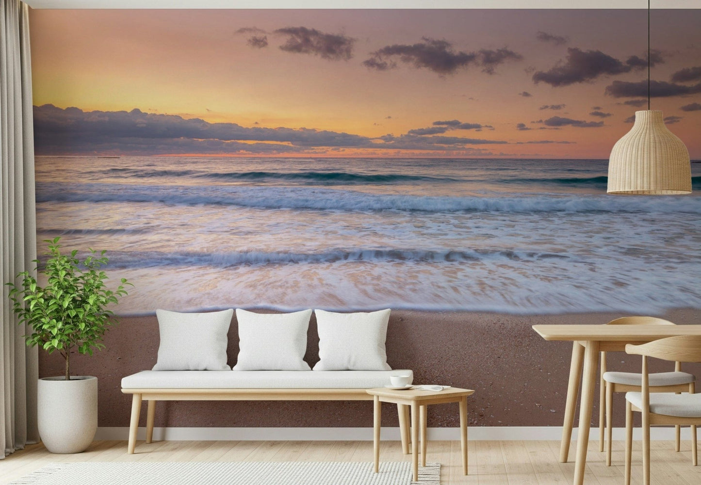 Peace at the Beach wallpaper mural of orange dusk surf above a cushioned entryway bench with white pillows