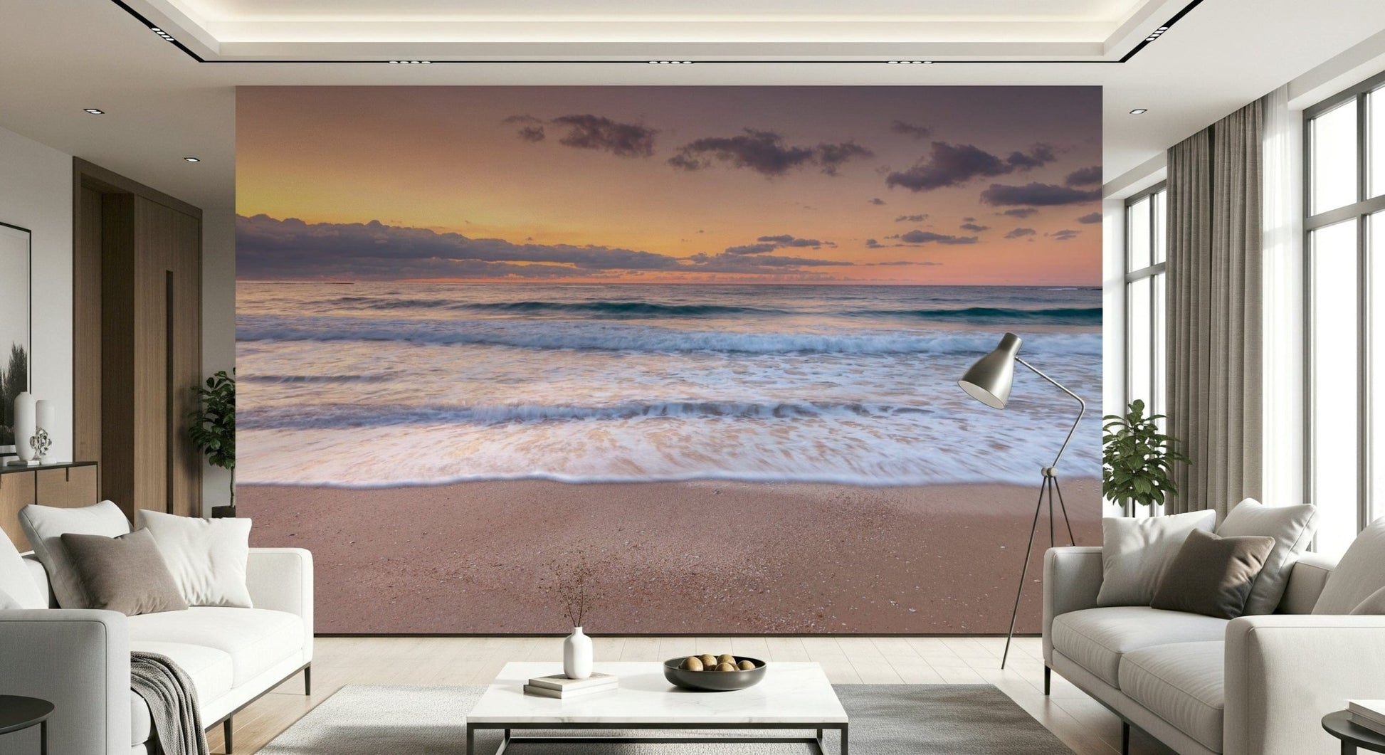 Peace at the Beach wallpaper mural of orange dusk waves in a living room with two white sofas and a floor lamp