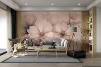 A wall mural of delicate peach blossoms on thin branches.
