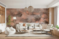 Subtle Canvas wallpaper mural in painterly peach and grey behind a cream sofa and beanbag chair in a living room