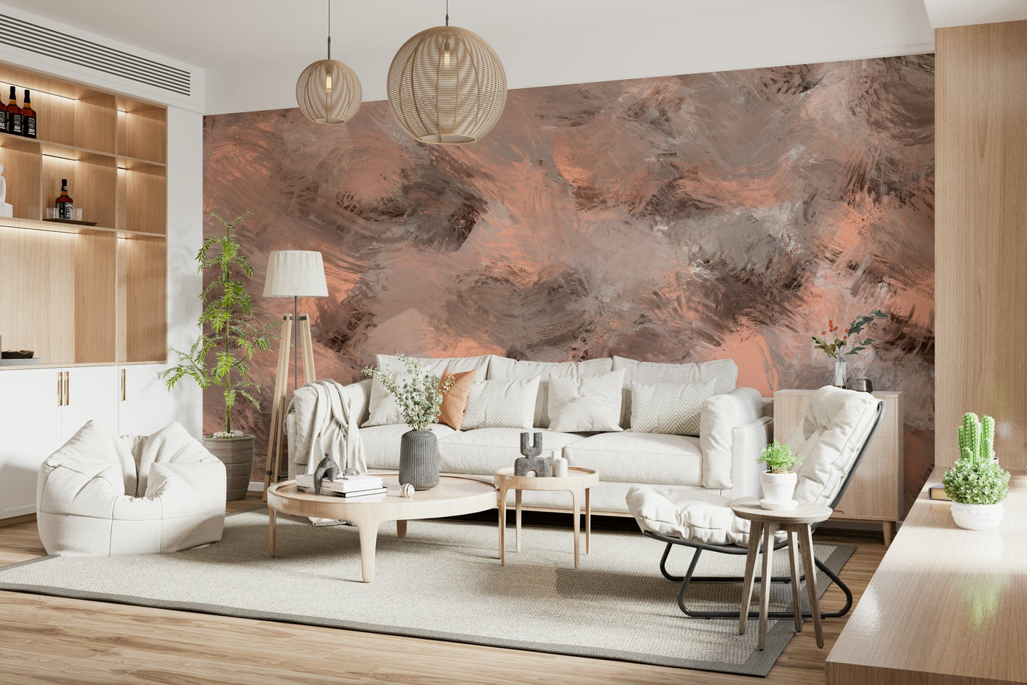 Subtle Canvas wallpaper mural of painterly peach tones behind a cream sofa and round wood table in a living room