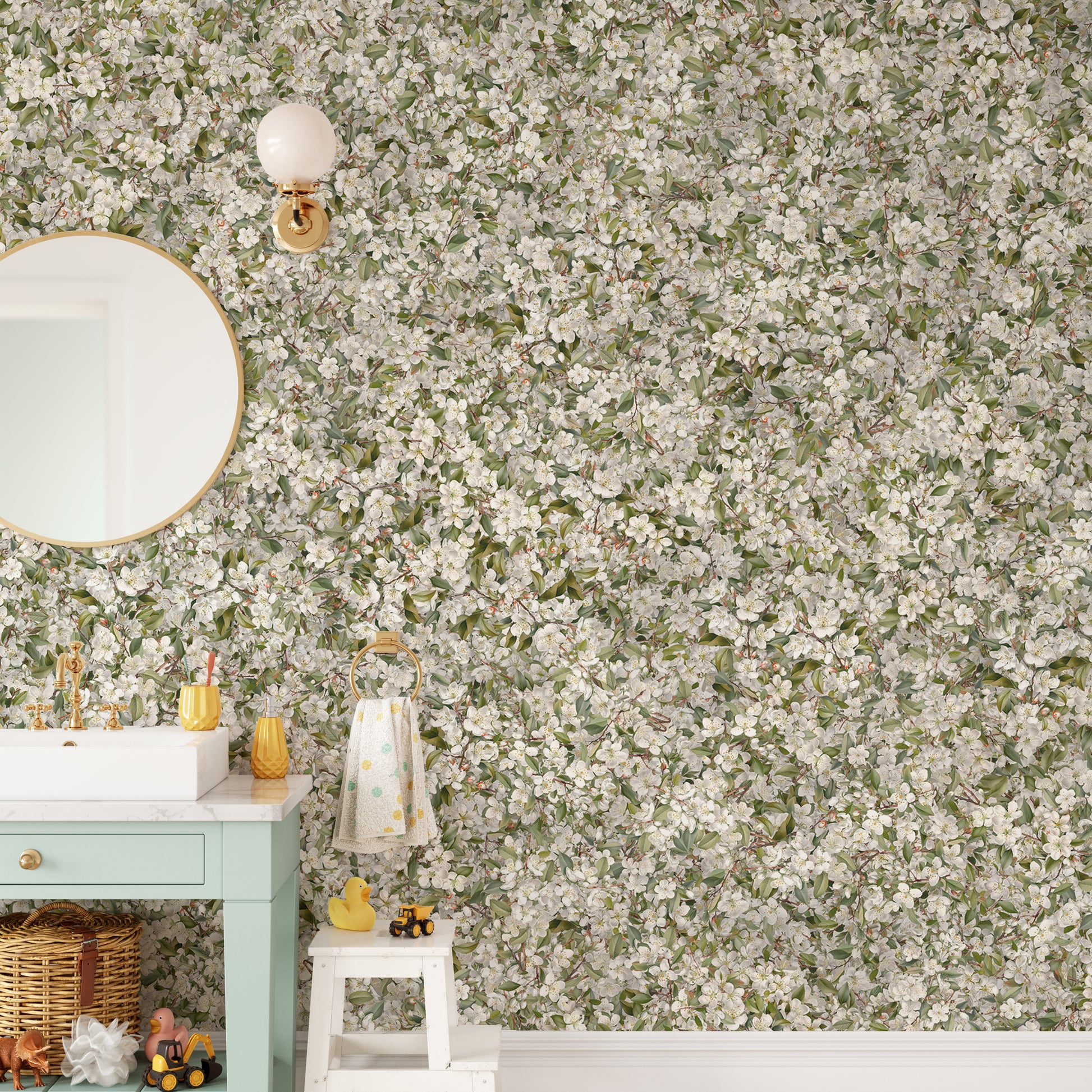 Pear Blossom White Flowers wallpaper mural in a green bathroom with a round mirror and white vanity sink