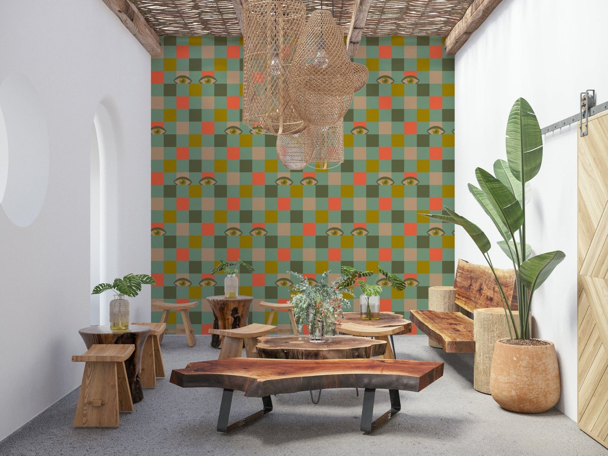 Checker-style wallpaper mixing warm and cool tones with scattered vintage eye symbols for a playful effect.