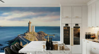 Lighthouse wallpaper on bedroom feature wall, calm ocean color palette
