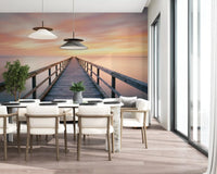 Coastal pier scene wallpaper with soft blue tones for dining room accent wall decor.
