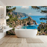 Pine-Framed Azure Coast wall mural with turquoise water and sunlit cliffside