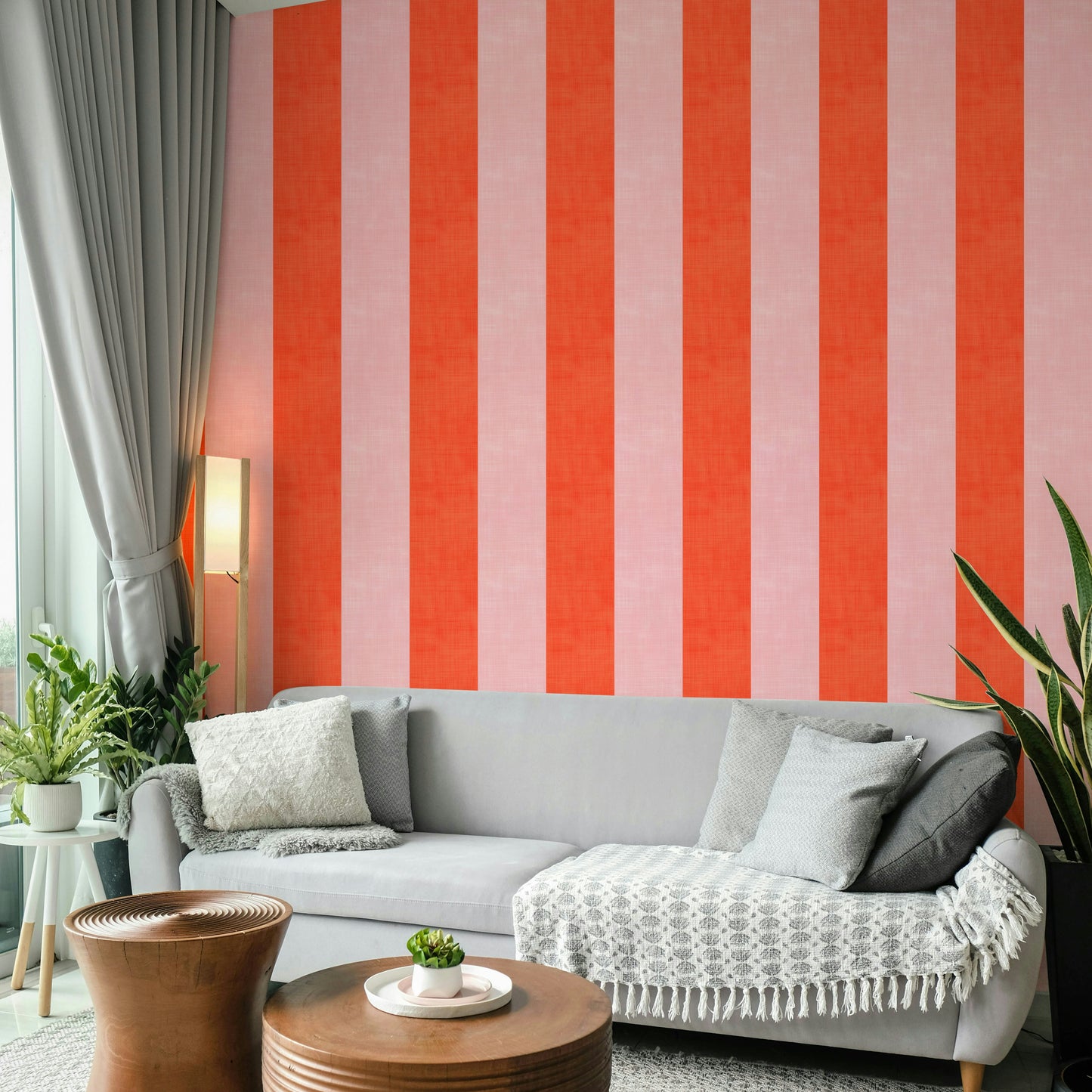 Pink and Red Stripes Linen Texture wallpaper behind a light gray sofa with a floor lamp in a living room