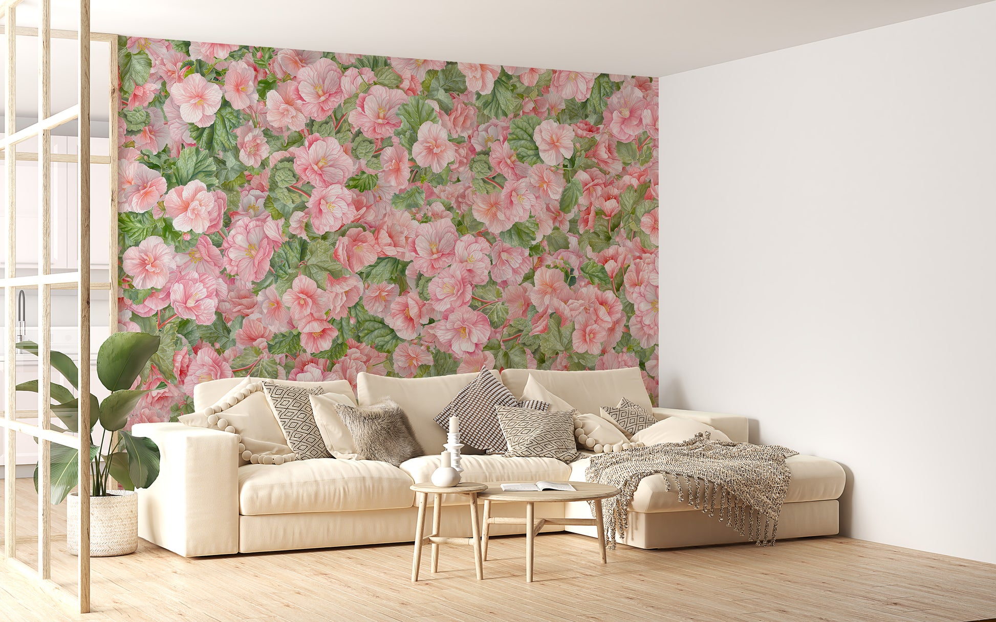 Pink Begonia Flower wallpaper mural behind a cream sectional sofa and tall green plant in a bright living room