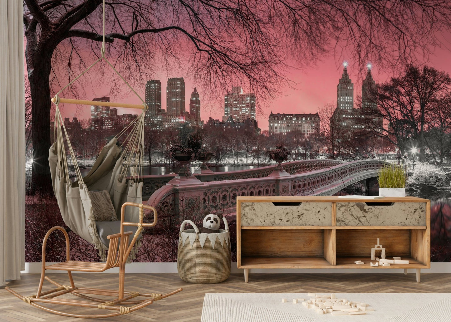 Lounge room with a pink skyline wall mural.

