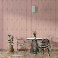 Modern geometric curves on a blush pink wallpaper.
