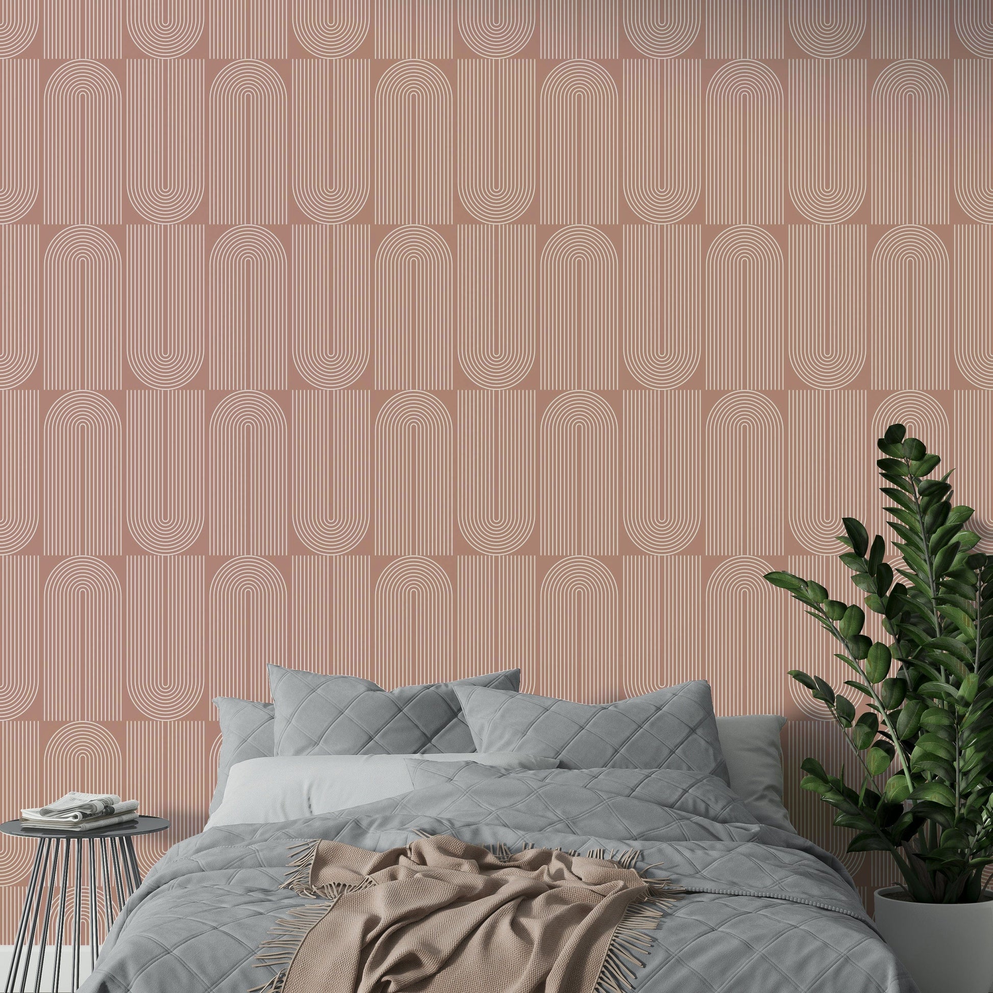Earthy desert rose paper with striped arch wallpaper.
