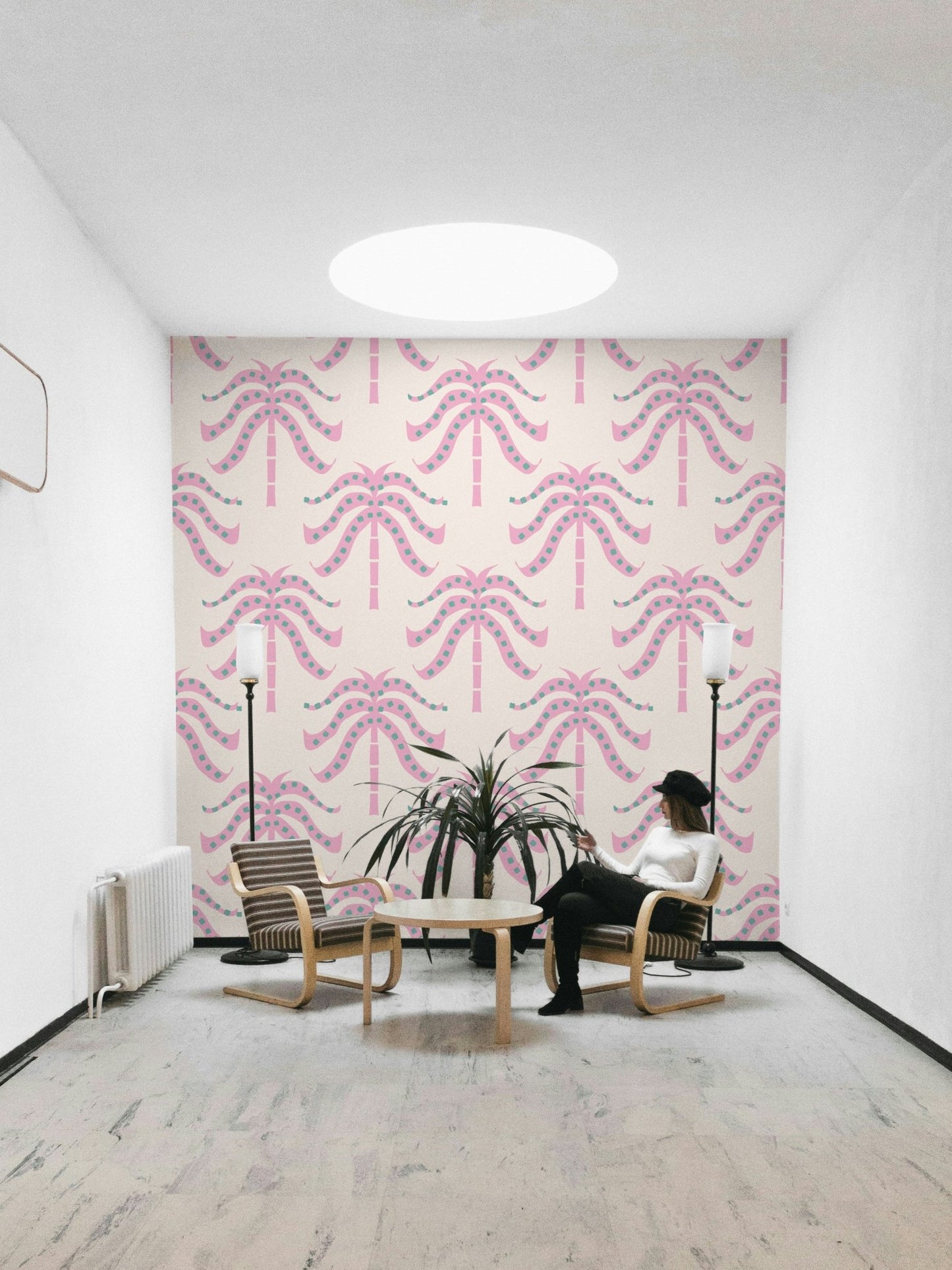 A wall mural of a tropical palm leaf pattern.

