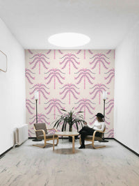 A wall mural of a tropical palm leaf pattern.

