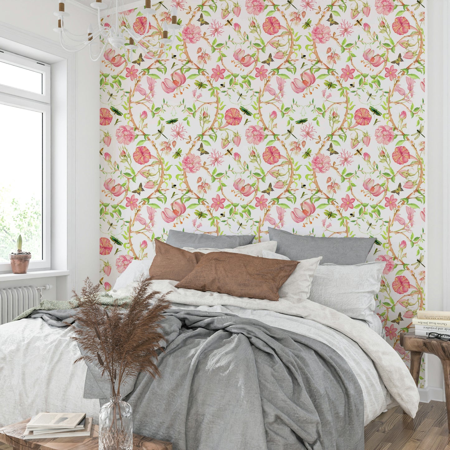 Watercolor chinoiserie wallpaper featuring light pink blooms.

